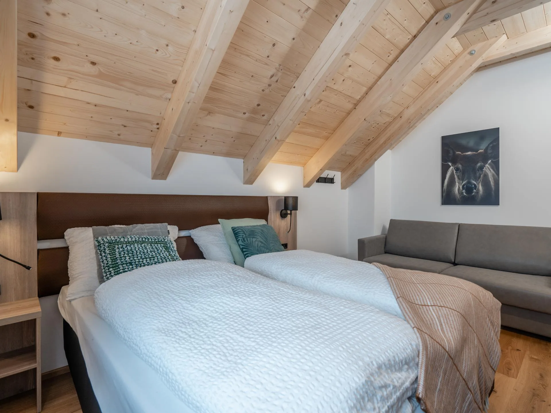 Haus Liene - Luxurious master bedroom with elegant furnishings, premium bedding and natural light in our Austrian Alps vacation rental