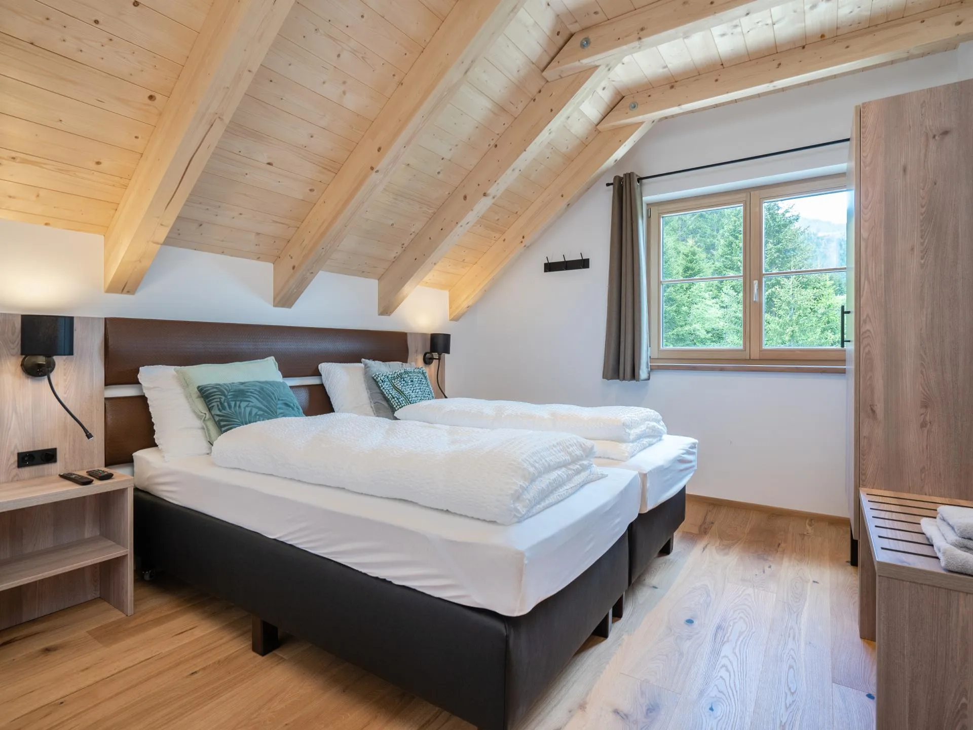 Haus Liene - Cozy bedroom featuring breathtaking mountain views, quality furnishings and comfortable bedding for ultimate relaxation