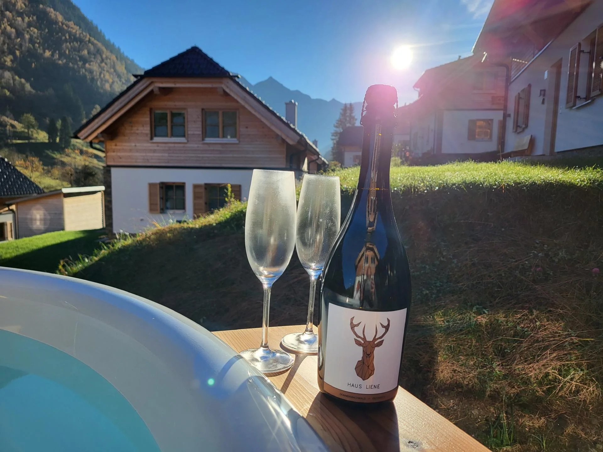 Haus Liene - Romantic dining area set for an evening meal with ambient lighting and mountain views in our luxury Austrian chalet